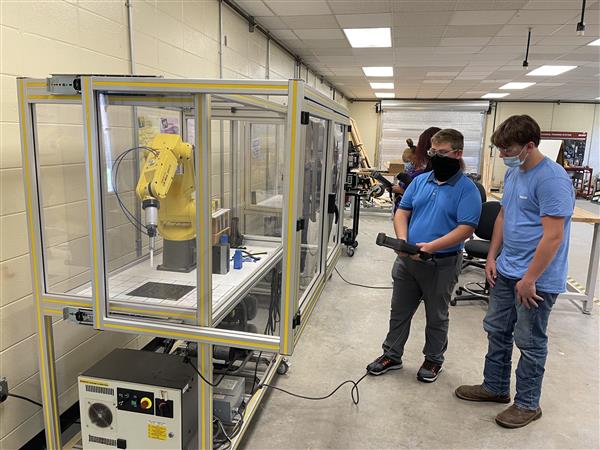 Students programming a robot