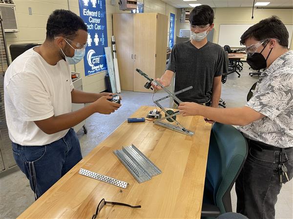 Students building a robot