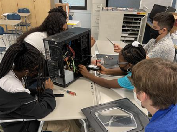 Students breaking down a CPU
